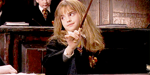 Gif of Hermione from Harry Potter waving a magic wand. 