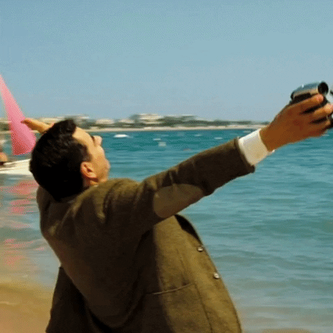 GIF - Mr Bean enjoying freedom on the beach